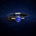 Croaix Constellation Bracelet glowing on midnight velvet